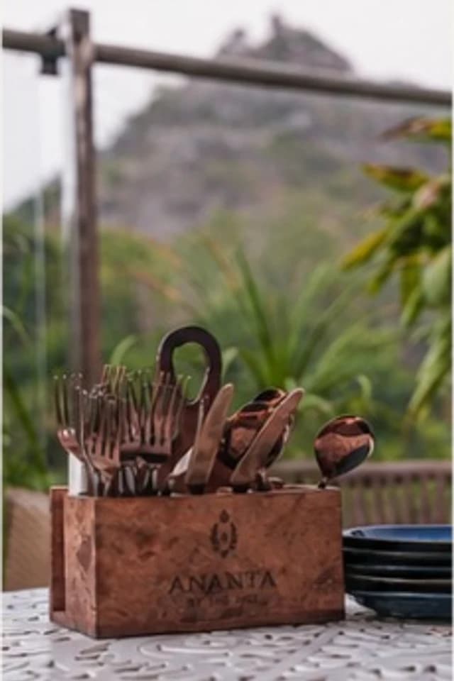 Ananta table setting with hillside views at dusk
