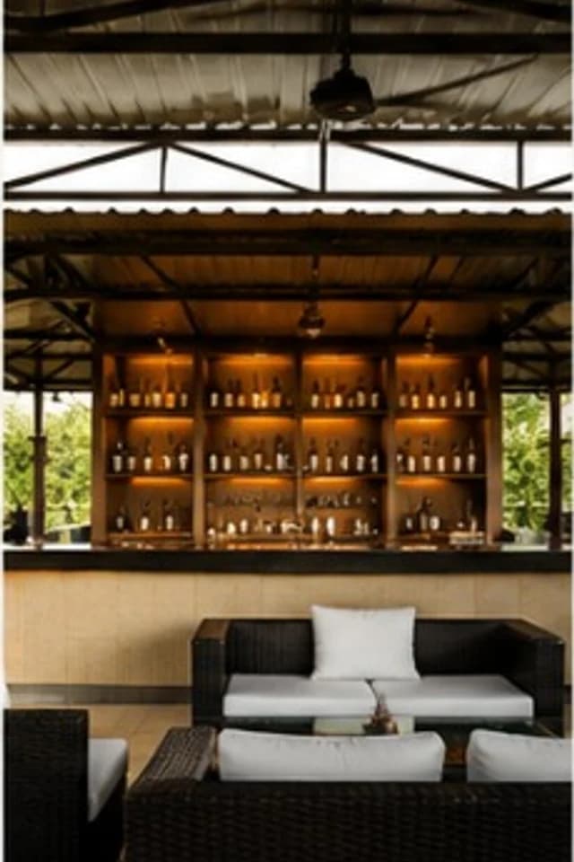Open-air bar and lounge at Ananta By The Hill